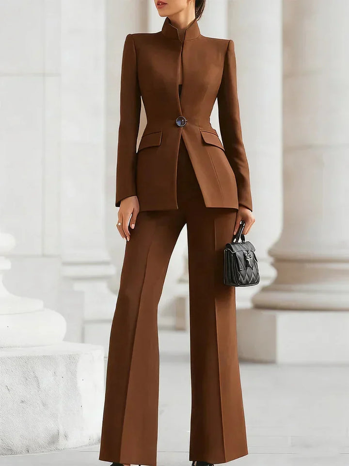 Tailored longline blazer and flattering flared trousers in a women's chic suit set. Business & office wear.
