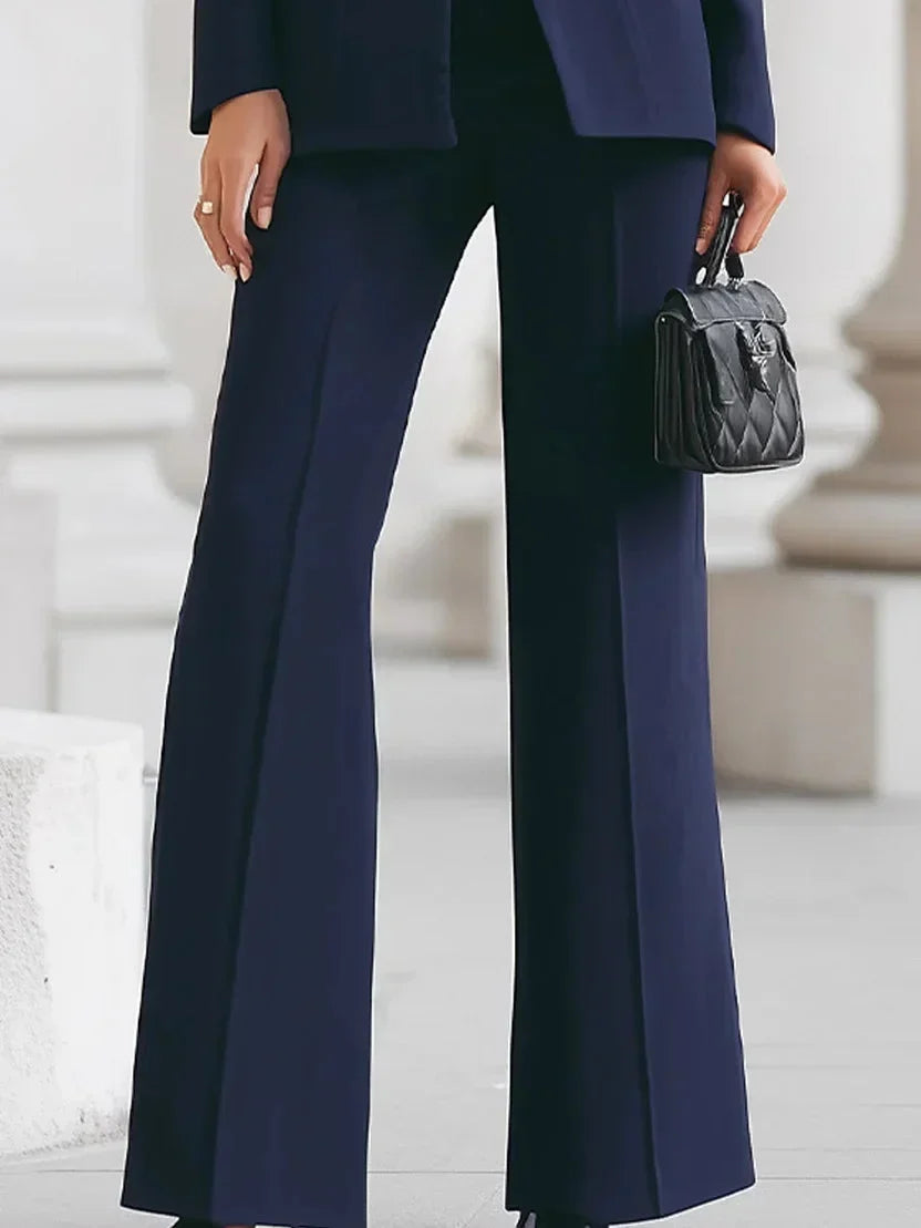 Command attention in this women's tailored blazer & flared trousers power suit. Professional & chic business attire.