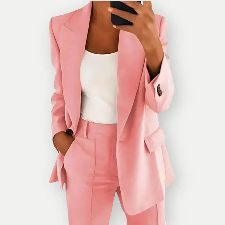 Professional women's power suit; a chic blazer & matching trousers for sophisticated office attire.