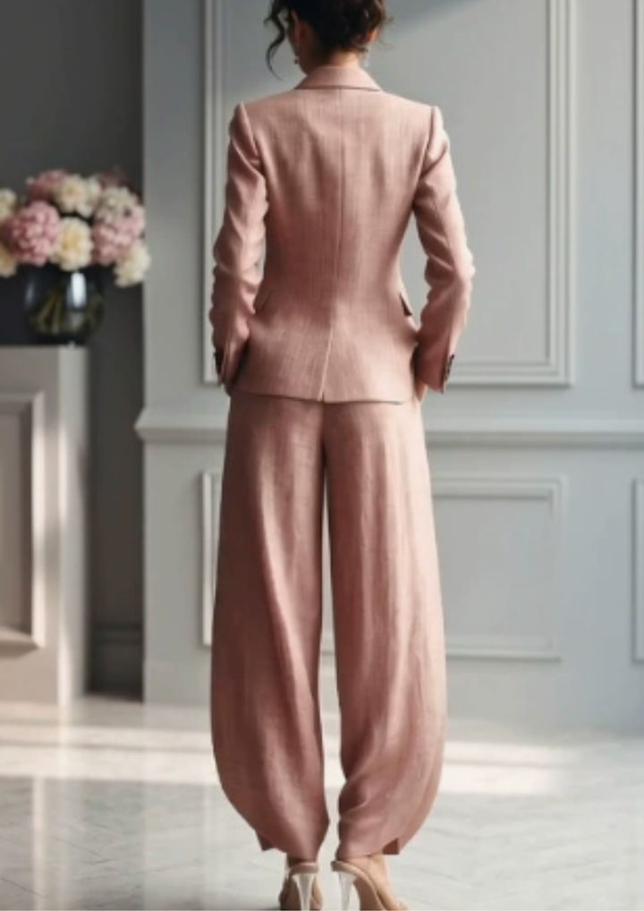 Elegant women's tailored blazer set with collared jacket and wide-leg pleated trousers, perfect for dressy occasions.