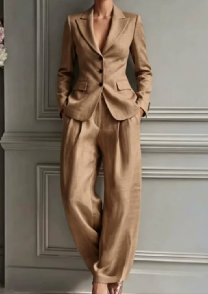 Two-piece women's tailored set: collared blazer and wide-leg pleated trousers. Elegant, versatile, and business-ready.