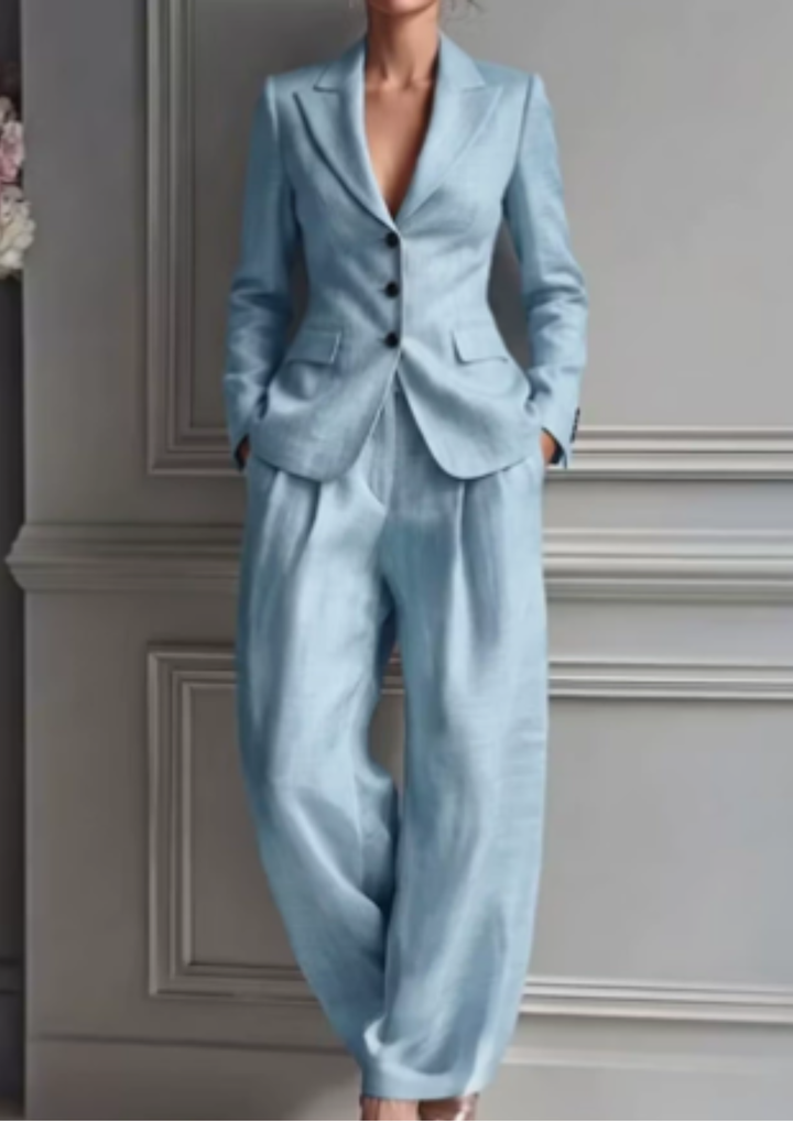 Women's elegant tailored blazer set featuring a collared jacket and comfortable wide-leg pleated trousers. Dressy & chic.