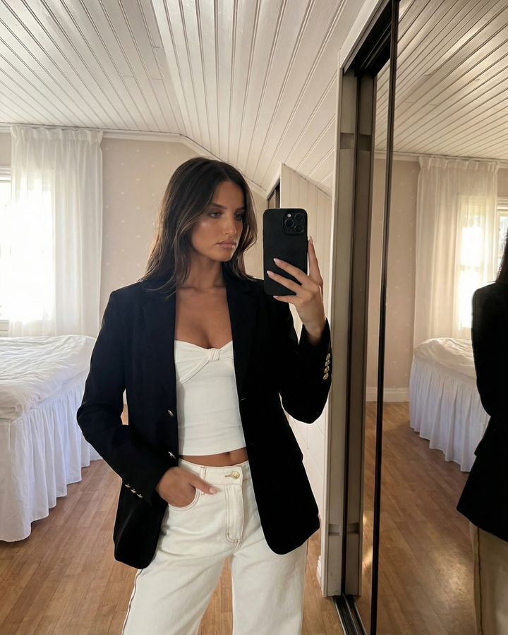 Chic women's structured blazer featuring shiny gold buttons, ideal for workwear, smart casual, or classic fashion.