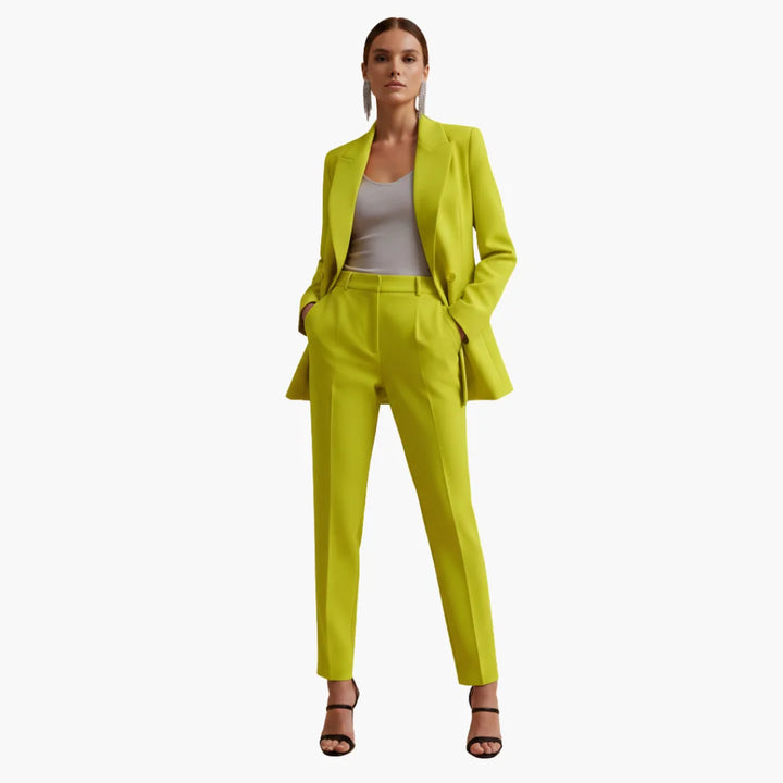 Women's designer look: tailored double-breasted blazer and professional pants suit.