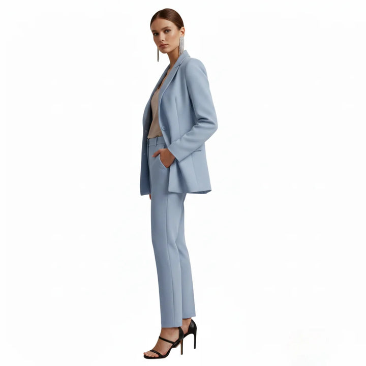Professional women's suit with a double-breasted jacket and classic tailored trousers.