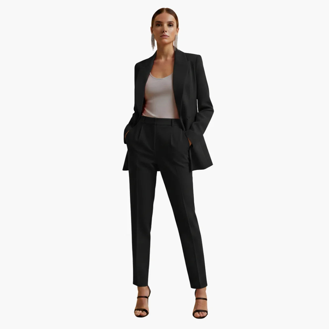 Modern women's two-piece suit: tailored double-breasted blazer & straight-leg pants.