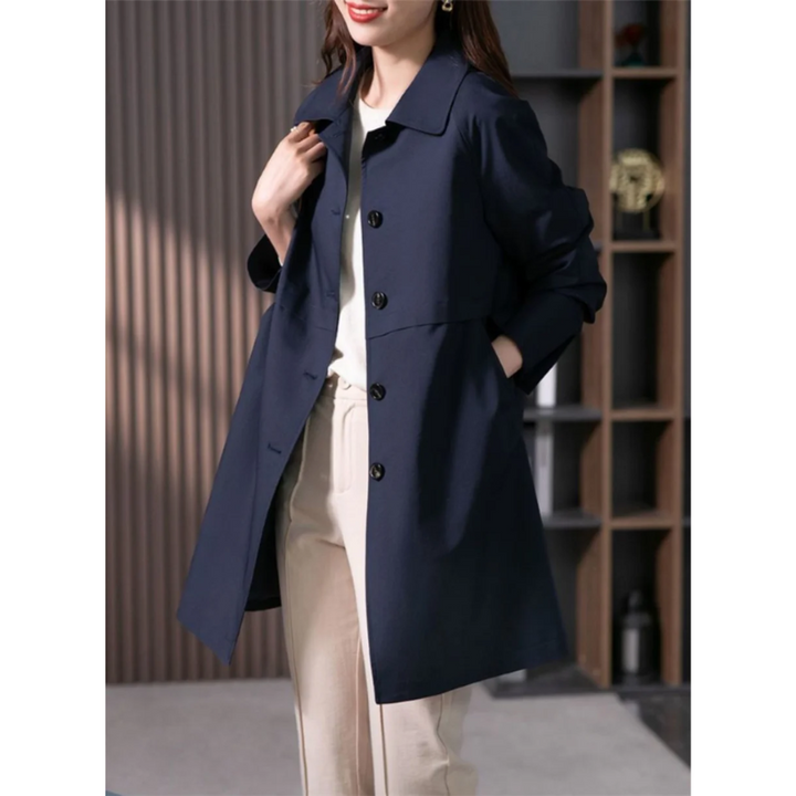 Chic black single-breasted women's trench coat. Tailored fit for sophisticated office or casual spring/fall fashion.