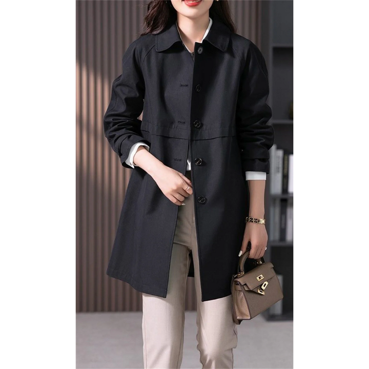 Sophisticated women's mid-thigh length tailored trench coat. Ideal for elegant spring or fall outerwear.