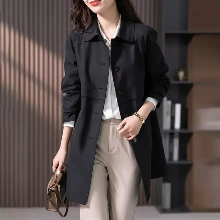Classic women's tailored trench coat. Mid-thigh length elegant outerwear, a sophisticated jacket for fall fashion.