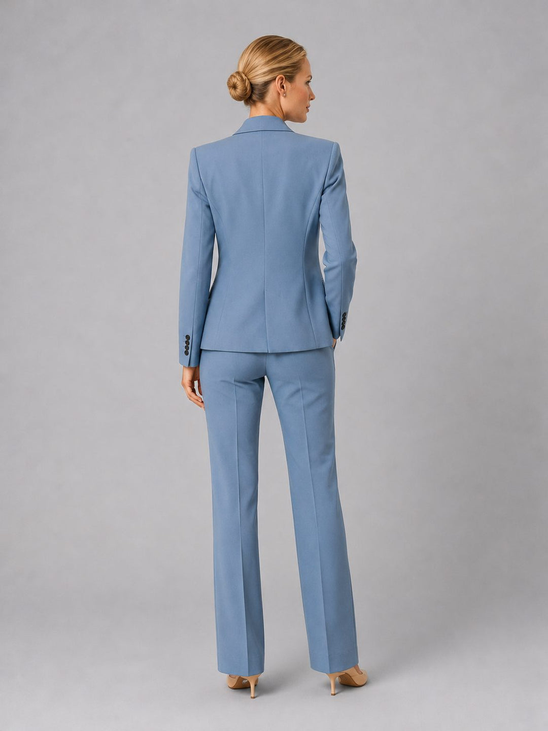 Elegant women's high-waist straight leg trousers, matching a tailored suit blazer. Versatile professional wear.