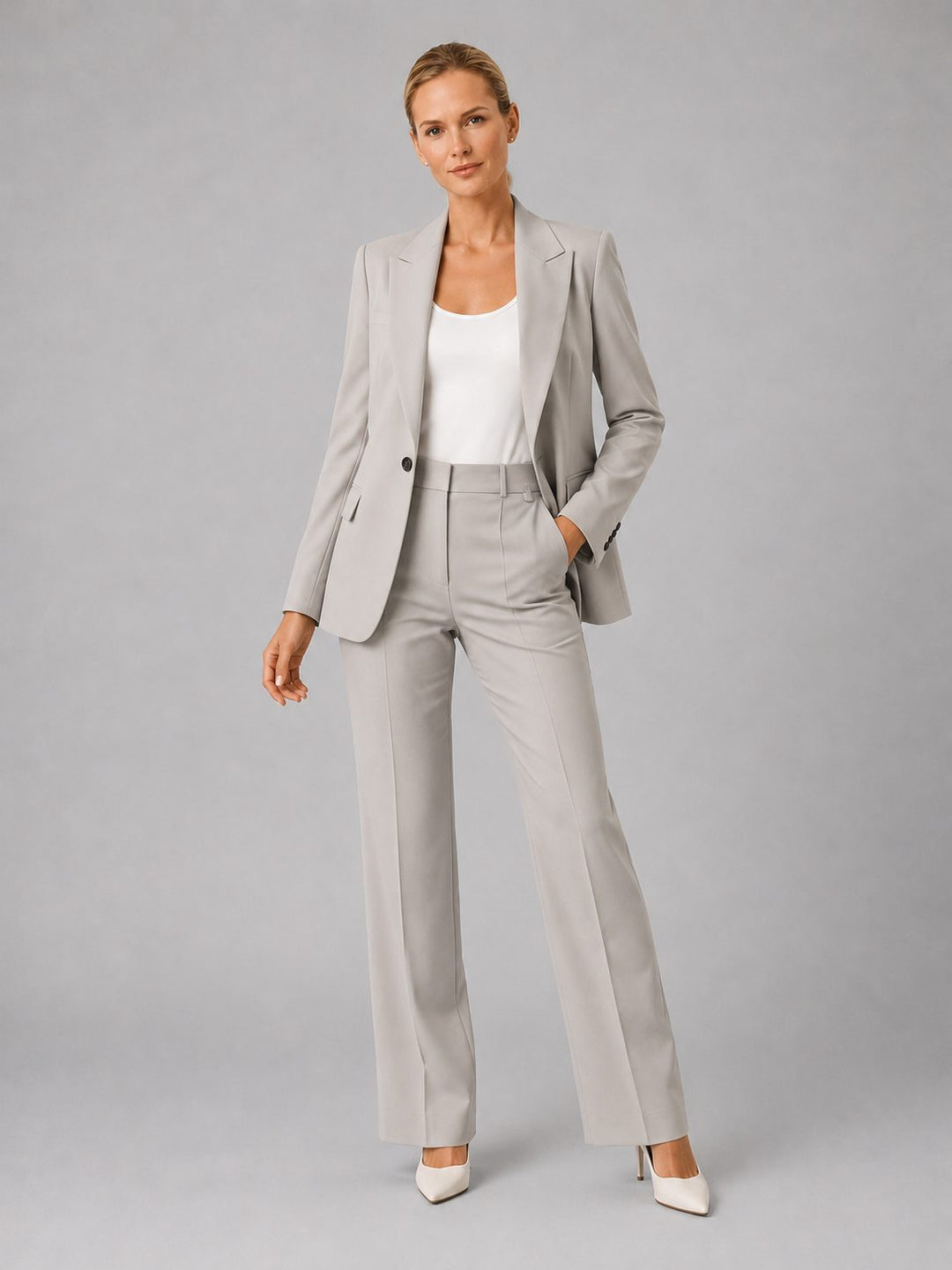Stylish women's tailored suit set for professional wear, featuring a blazer & high-waist straight leg trousers.