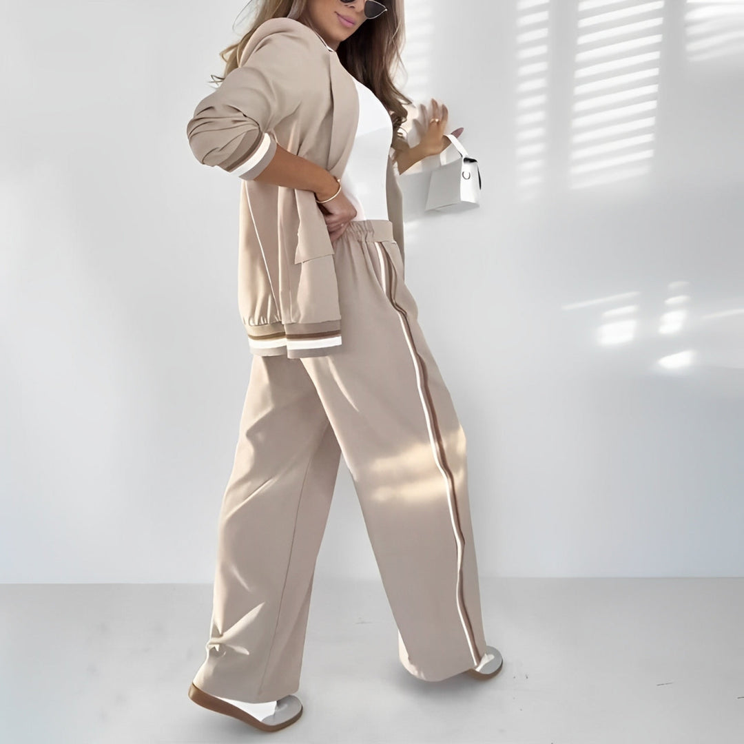 Two-piece women's tailored set featuring an elegant blazer and comfortable, straight-leg lounge trousers.