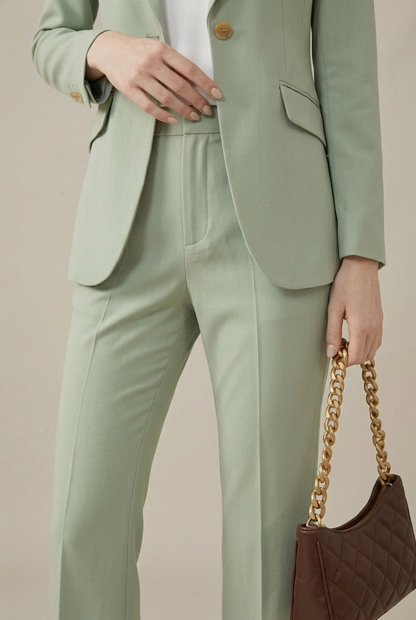 Elegant women's two-piece pant suit set with a stylish tailored blazer & trousers. Business fashion.