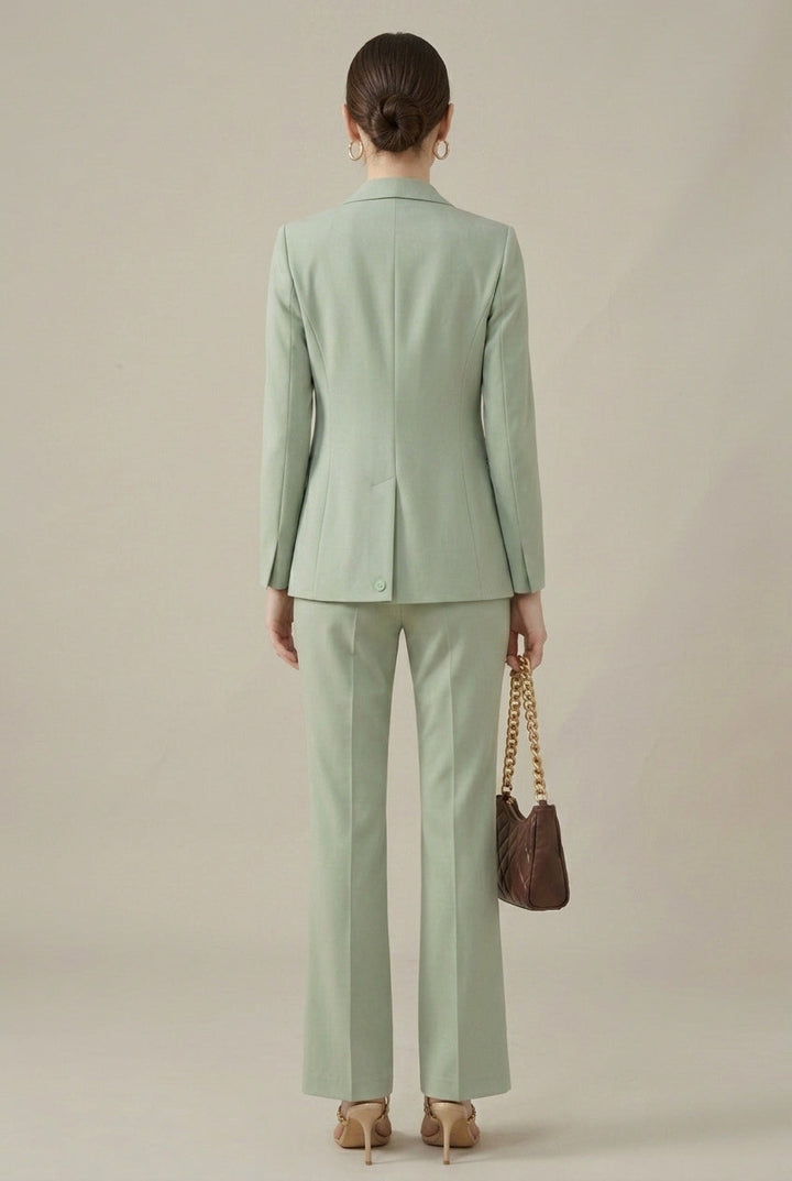 Professional women's tailored suit. Shawl collar blazer & smart trousers. Ideal formal office attire.
