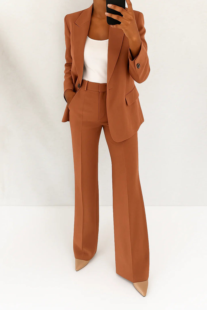 Classic women's professional suit set: tailored blazer & matching trousers for sophisticated business attire.
