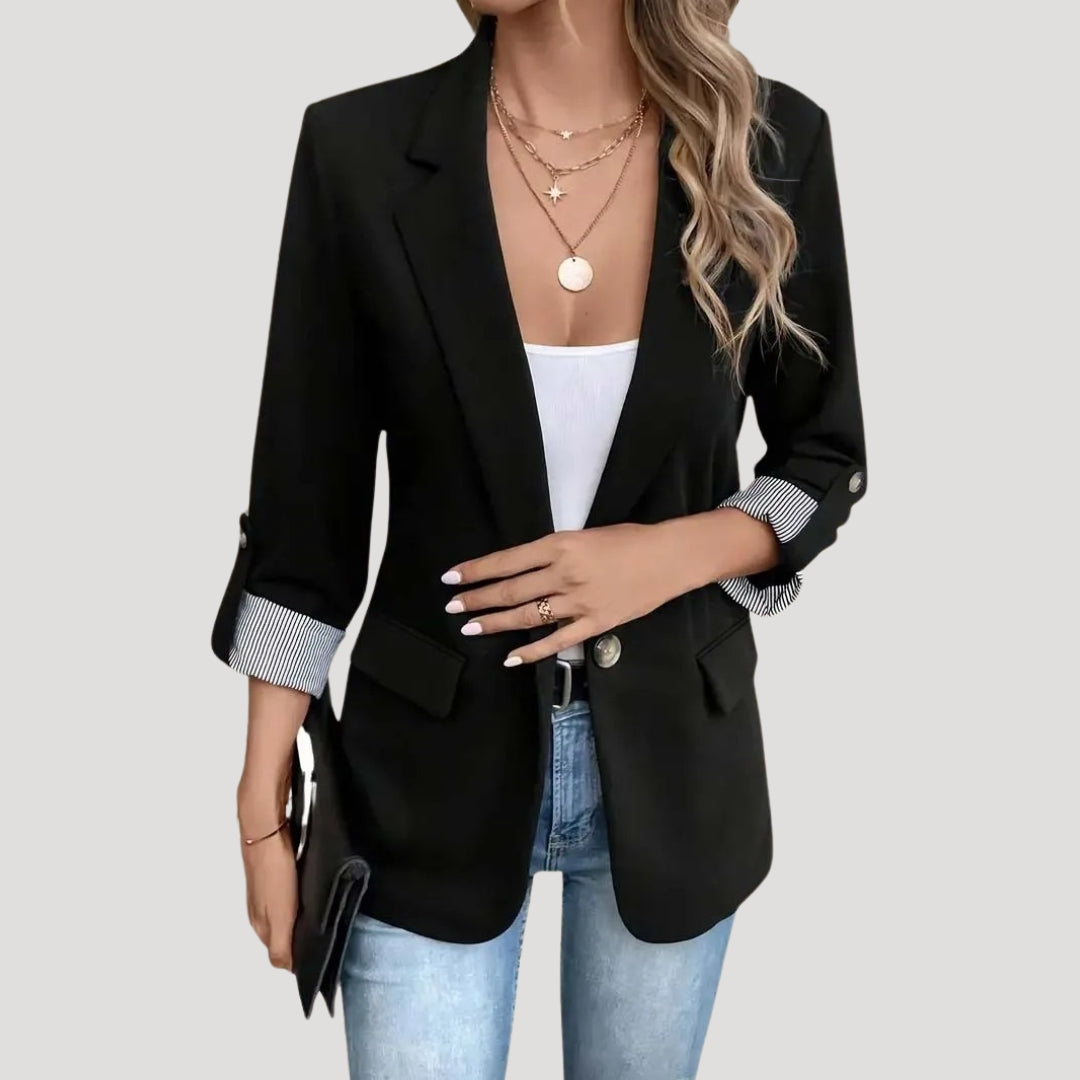 Sophisticated women's tailored blazer, ideal for warm weather, featuring a chic roll-up sleeve design.