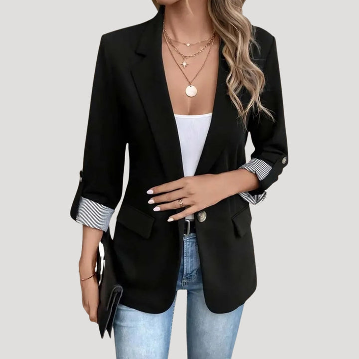Sophisticated women's tailored blazer, ideal for warm weather, featuring a chic roll-up sleeve design.