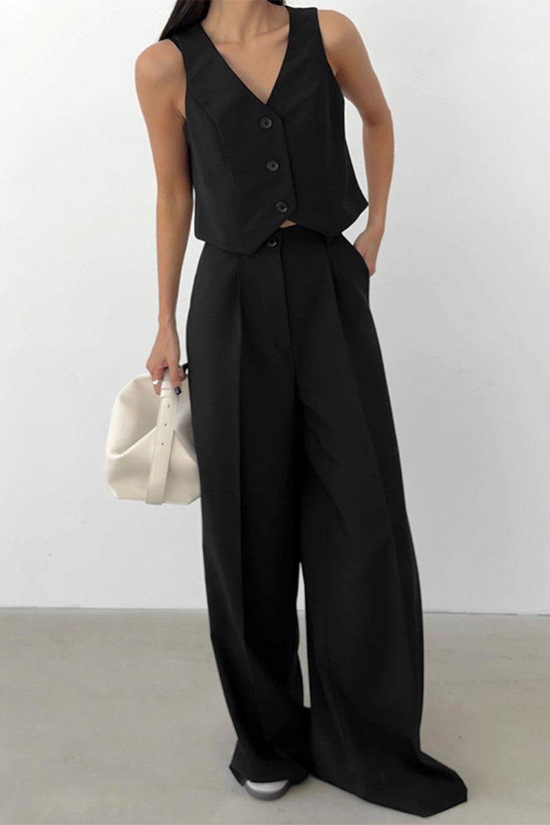 Green women's sleeveless waistcoat and wide-leg pant set, ideal for elegant workwear or smart casual looks.