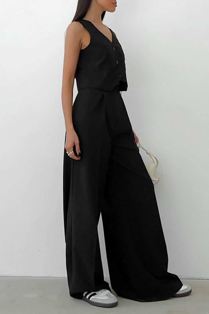 Tailored women's two-piece set: button-front sleeveless waistcoat and flowing wide-leg trousers.