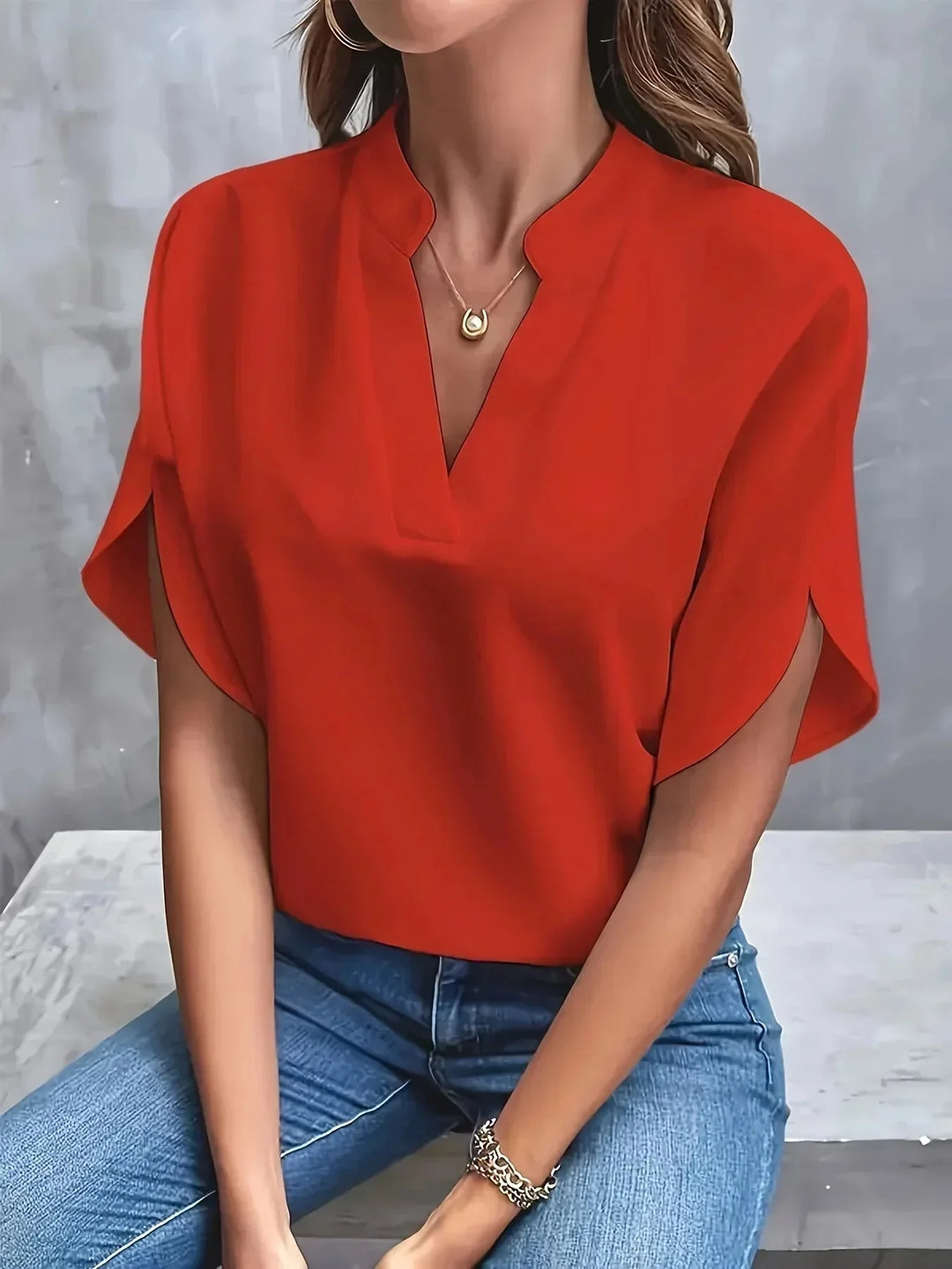 Tailored V-neck blouse for women, stand collar, stylish split short sleeves. Chic versatile top.