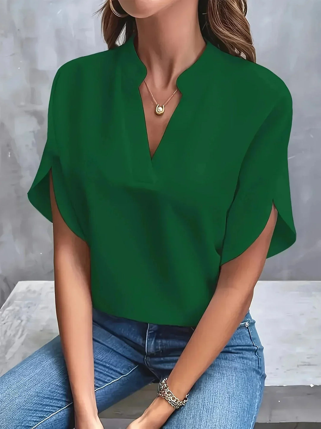 Versatile women's short sleeve V-neck blouse with stand collar. Tailored chic fashion top.