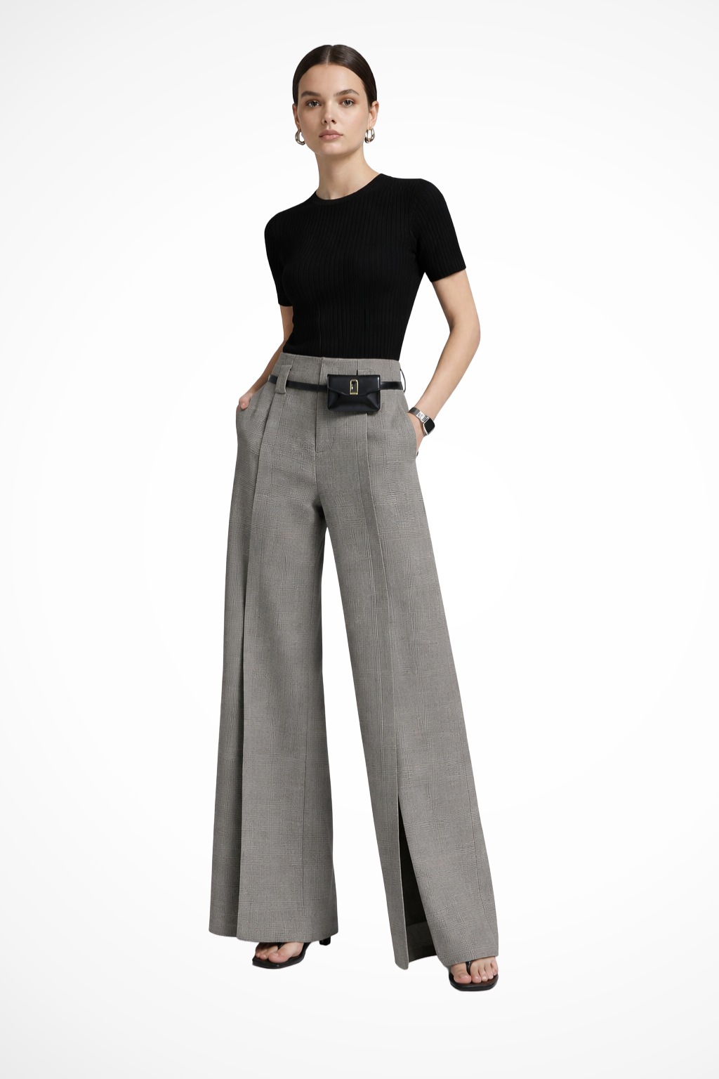 Woman modeling tailored wide leg trousers with belt detail. High-waisted fit for a sophisticated look.