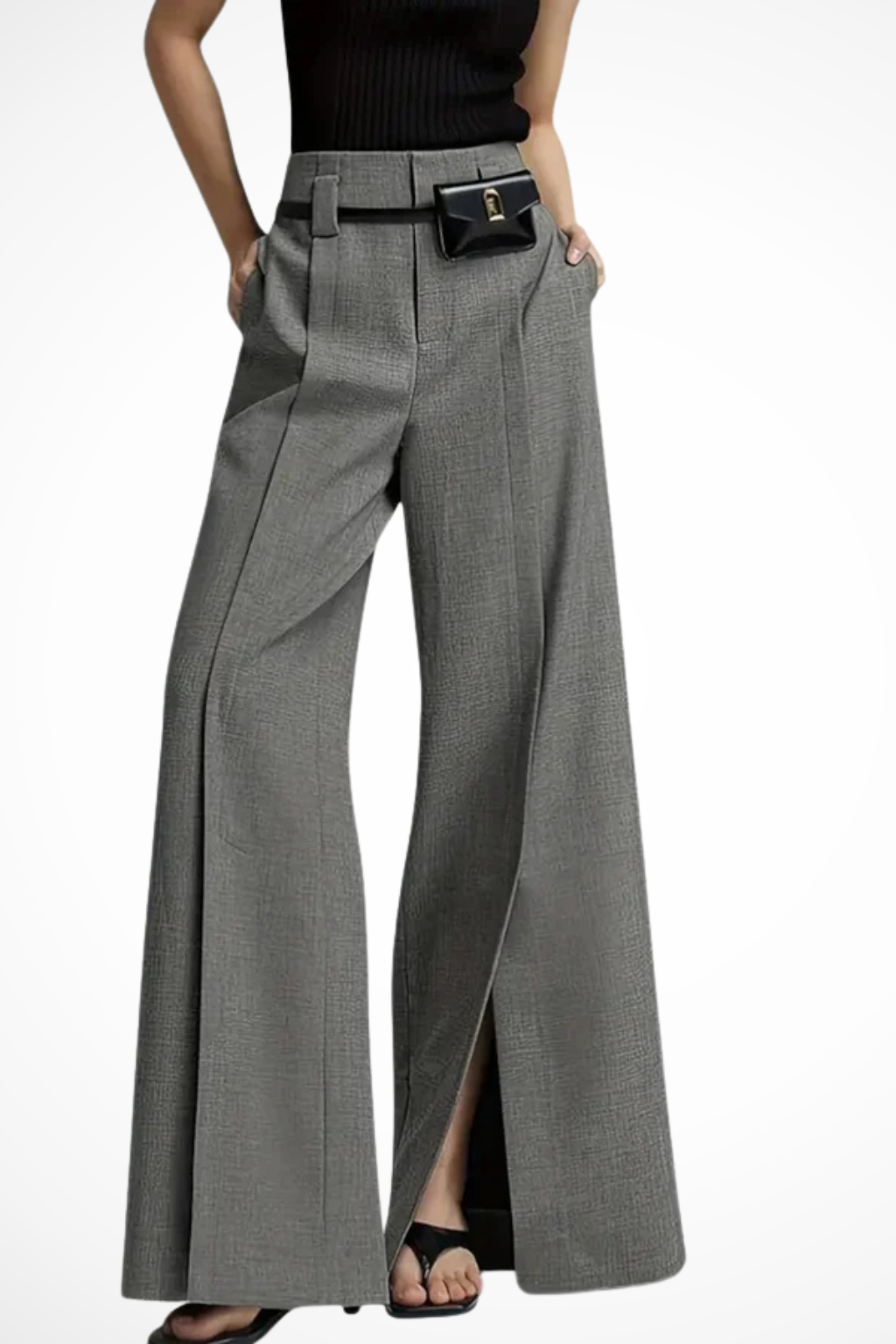 Close-up of the stylish belt on women's high-waisted wide leg tailored trousers. Modern & elegant.