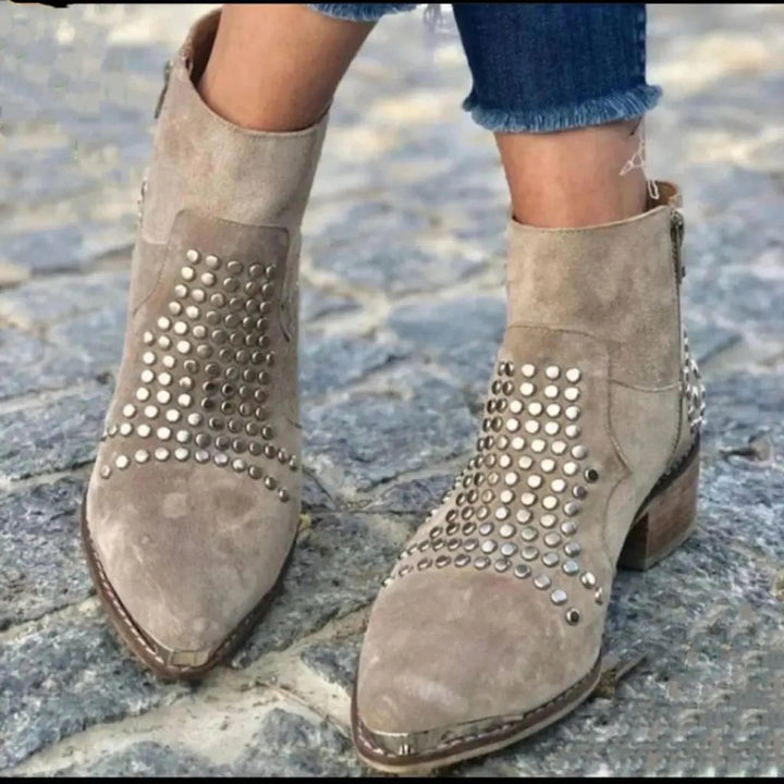 Comfortable women's studded taupe ankle boots with a pointed toe & block heel, perfect for edgy fashion.