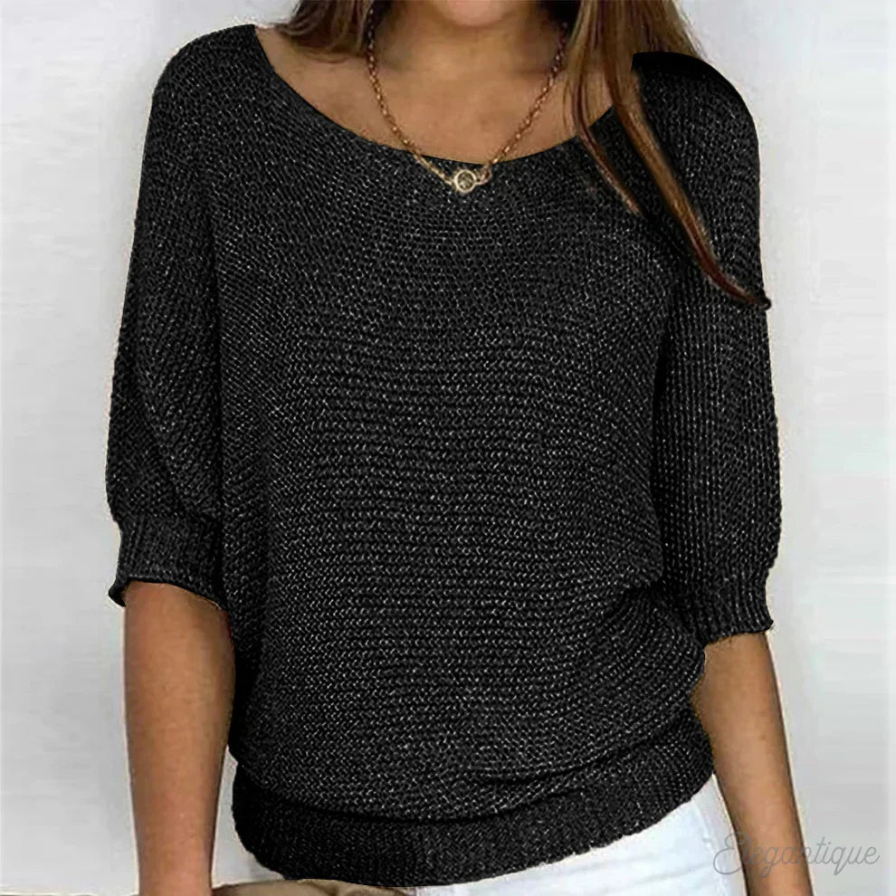 Relaxed fit women's top with stylish batwing sleeves and unique textured fabric for comfort.