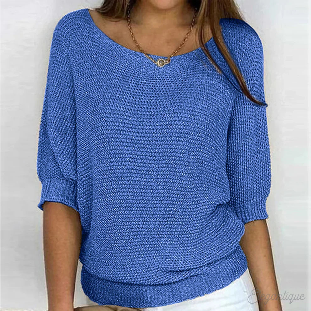 Versatile women's textured top with batwing sleeves, ideal for casual wear or dressed up chic.