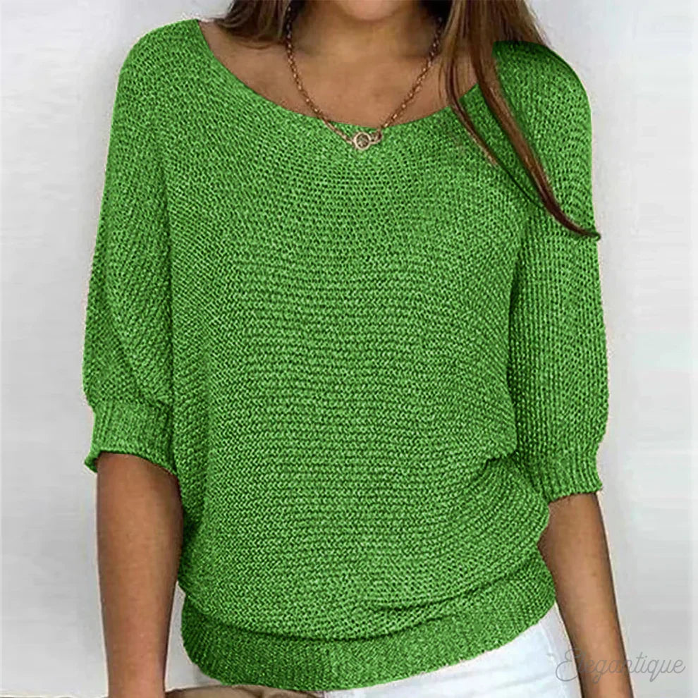 Stylish women's batwing sleeve top with a textured finish, offering a comfortable relaxed fit.