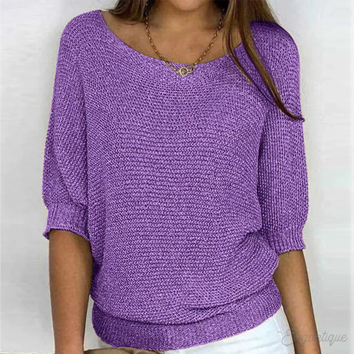 Chic women's textured blouse with comfortable batwing sleeves and a relaxed, loose fit.