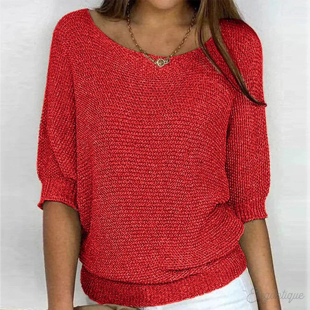 Women's loose fit top, elegant batwing sleeves, and soft textured fabric for versatile styling.