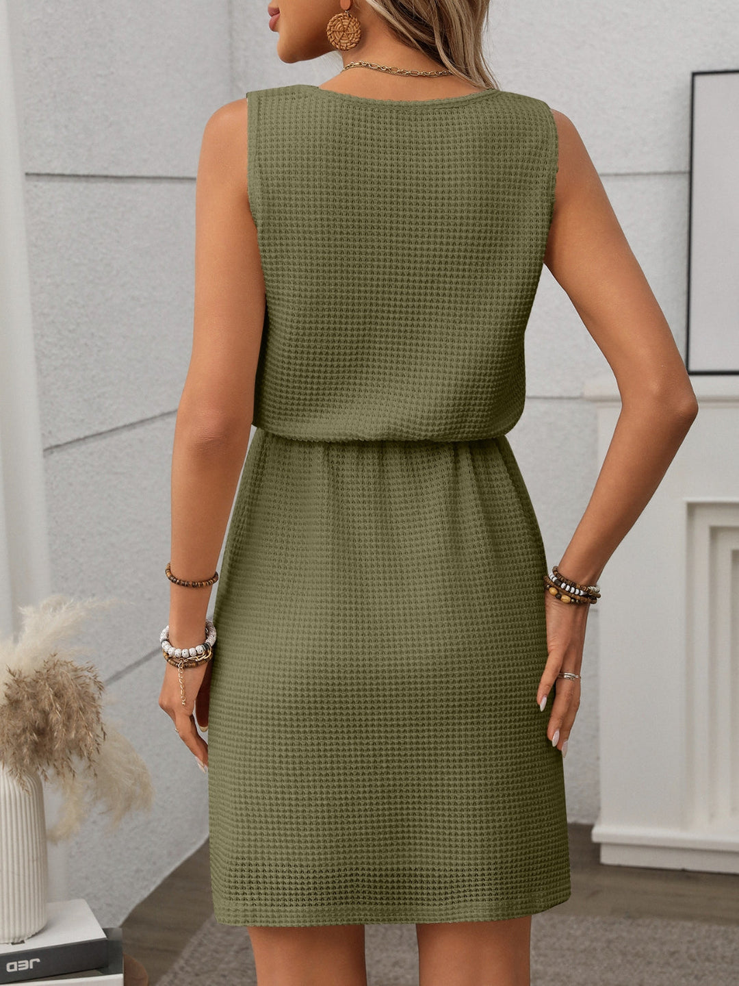 Women's easy-to-wear textured mini dress, tank top style, perfect for warm days.