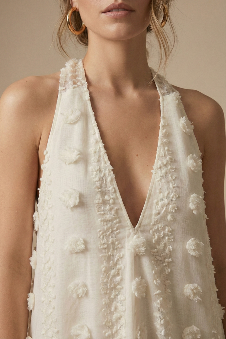 Elegant backless halter maxi dress for women, featuring intricate 3D floral appliqué & unique texture.