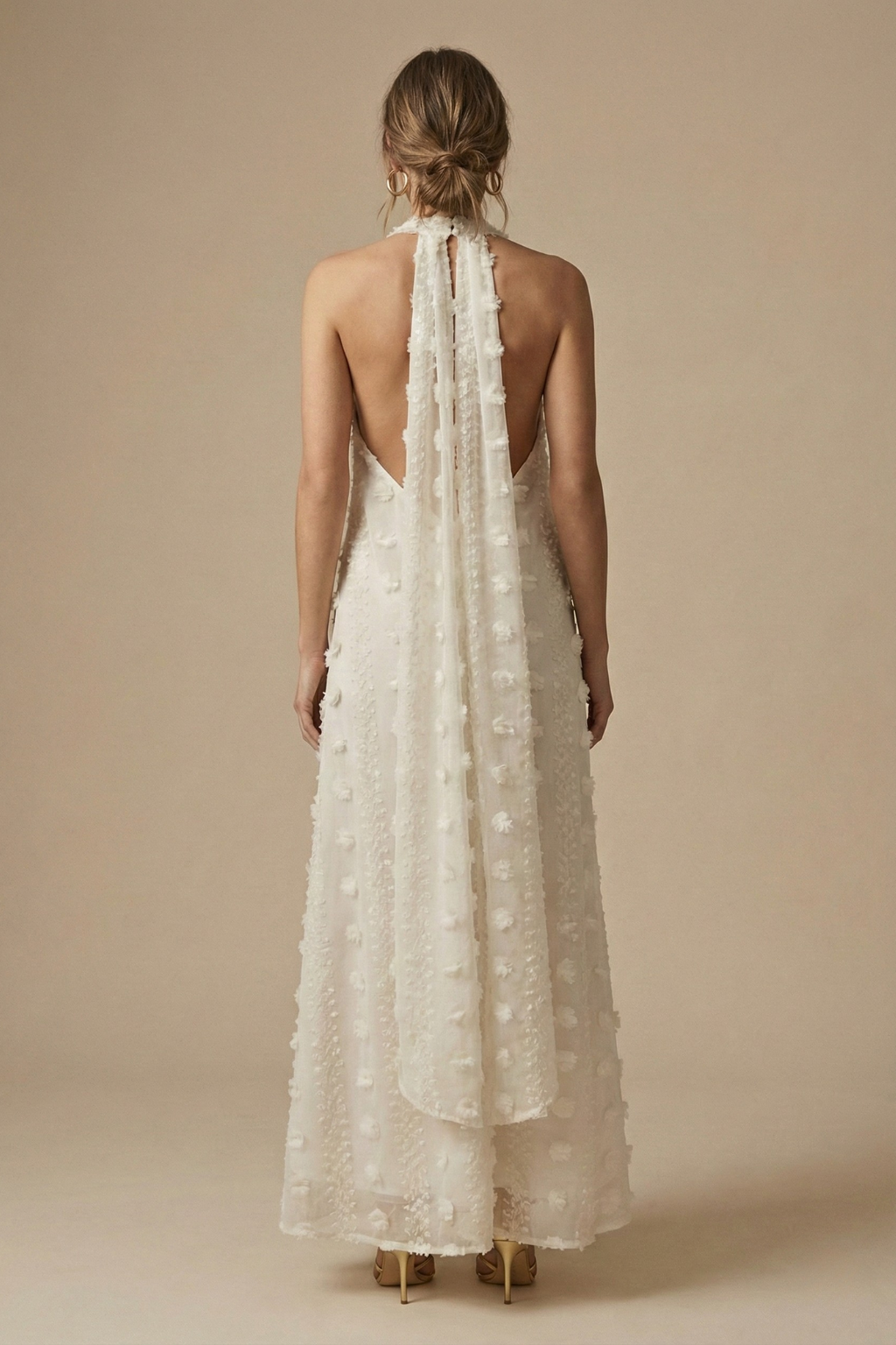 Textured halter maxi dress for women with beautiful 3D floral appliqué, ideal for summer parties.