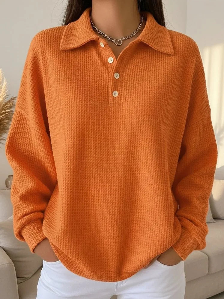 Versatile women's textured polo sweater with long sleeves. Casual yet chic fall/winter knit with button details.