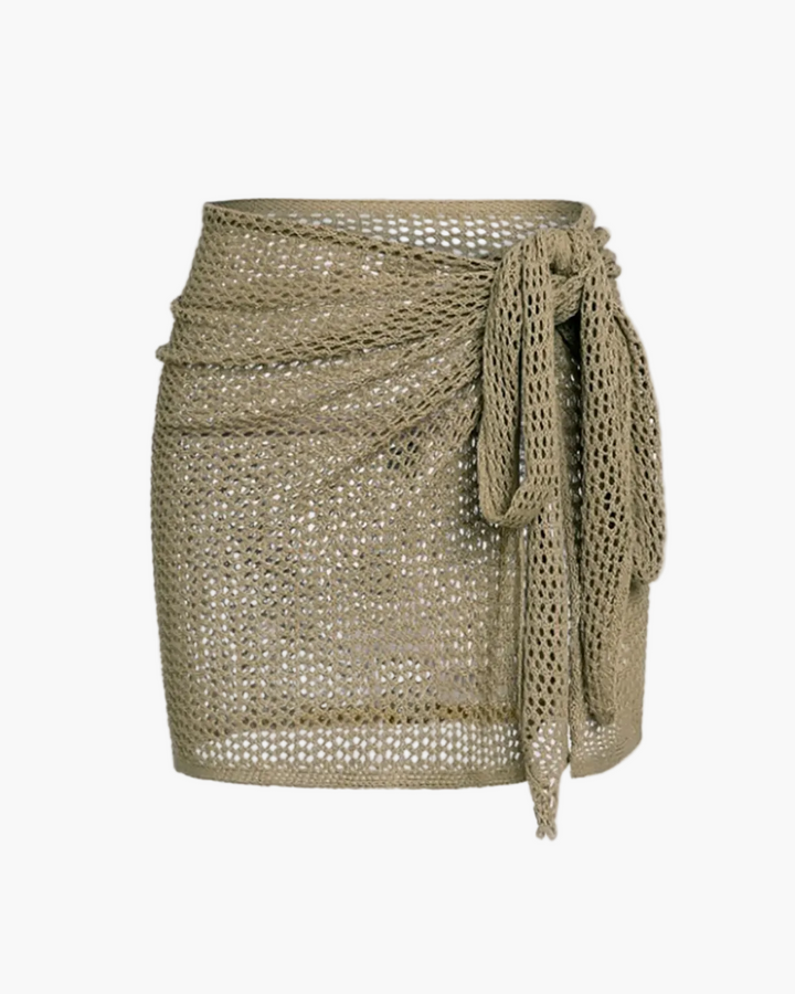 Women's textured open-knit beach cover-up mini skirt, perfect for summer swimwear & resort wear.