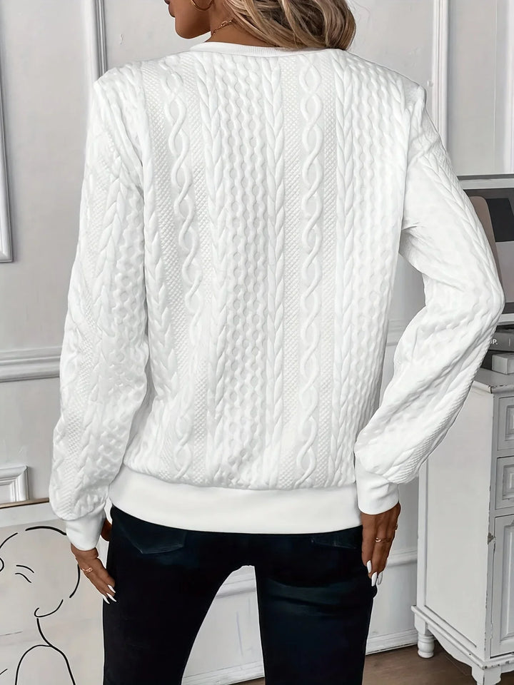 Women's textured quarter-zip sweater, long sleeves, stylish and comfortable everyday top.