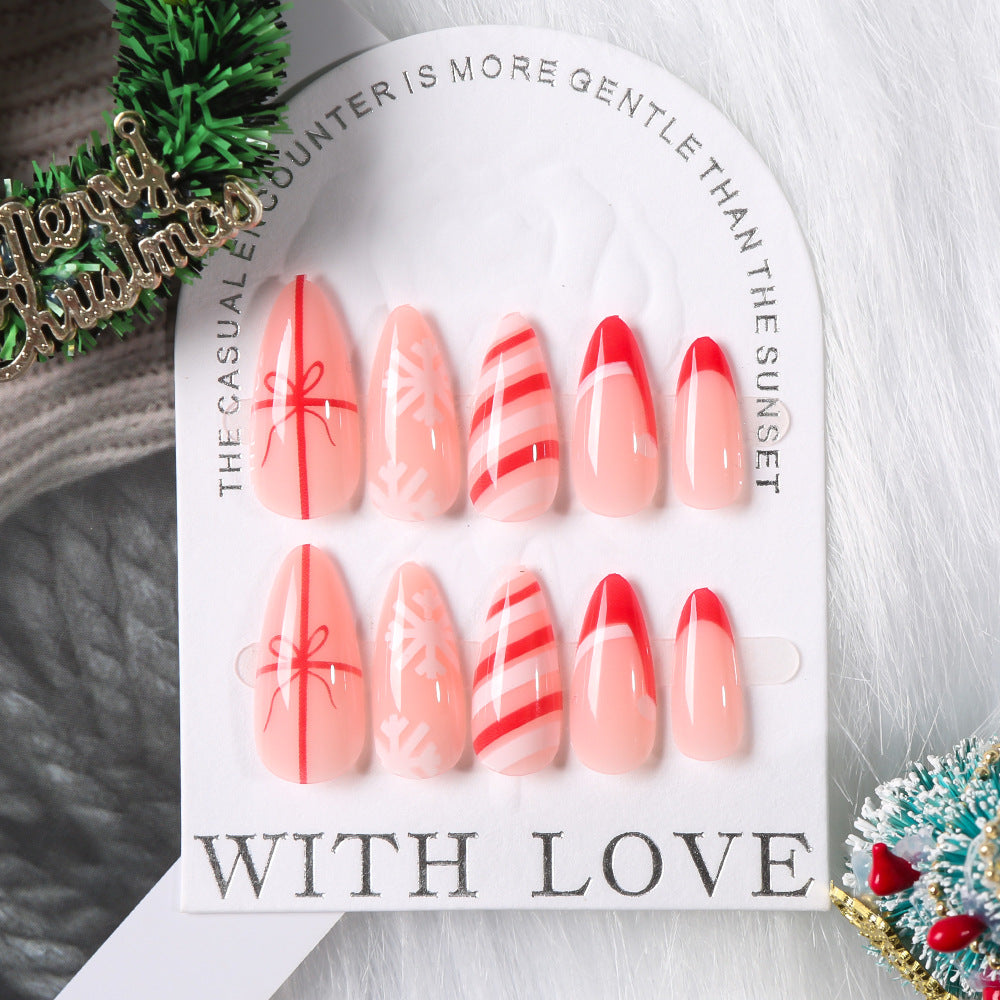 Close-up of stylish themed press-on nail art, featuring intricate designs for a fashionable look.