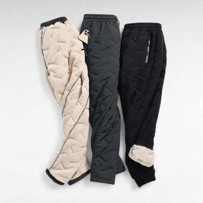 View of women's thermal waterproof winter trousers, highlighting straight cut, insulated fabric for cold weather.