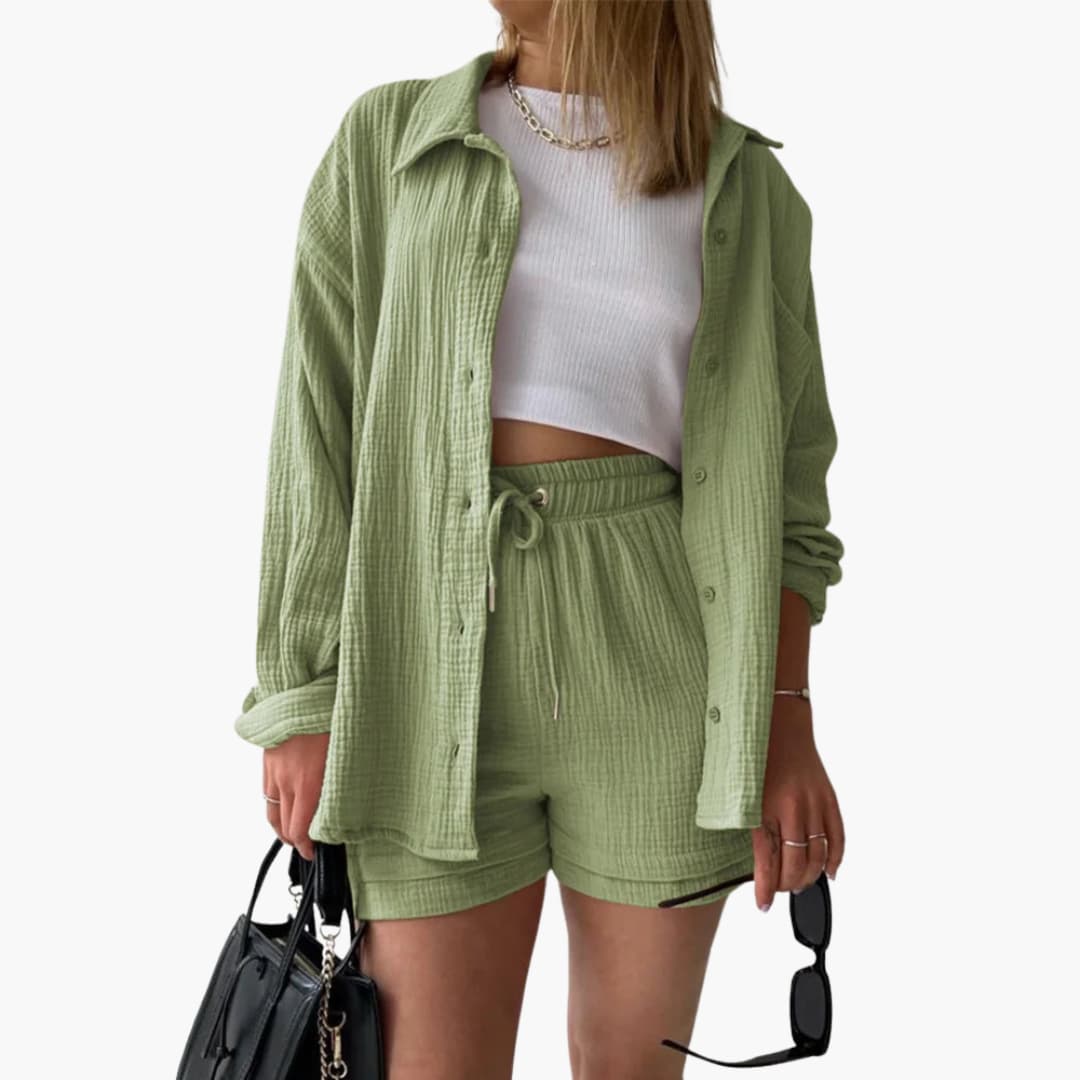 Fashionable women's summer outfit, a three-piece set with a versatile shirt, crop top, and comfy shorts.