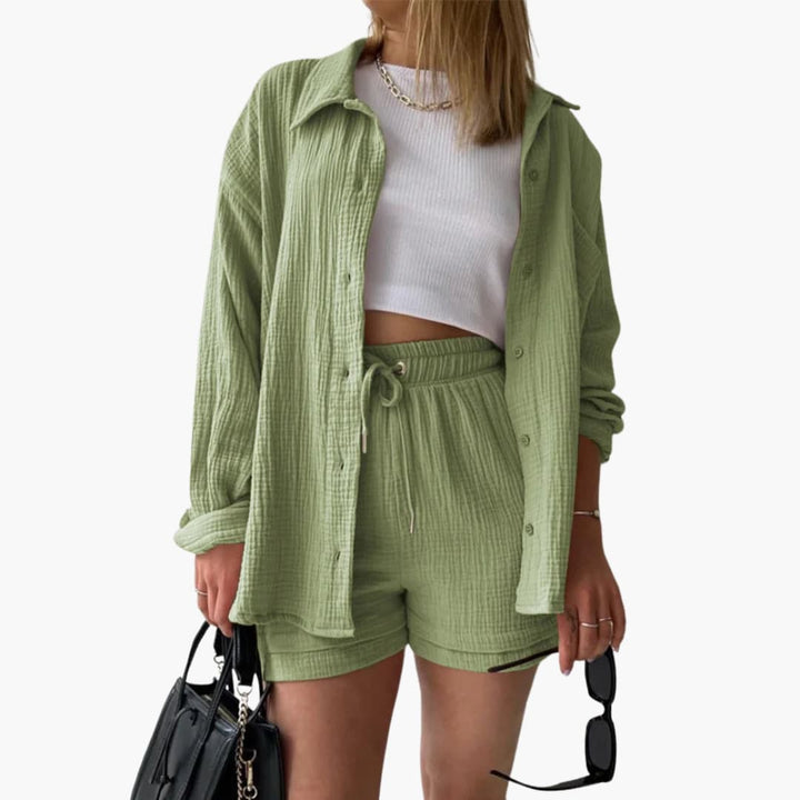 Fashionable women's summer outfit, a three-piece set with a versatile shirt, crop top, and comfy shorts.