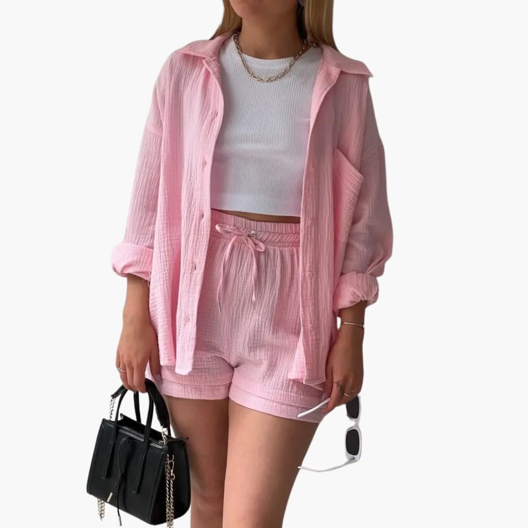 Women's three-piece summer set: stylish shirt, crop top, high-waist shorts for coordinated fashion.