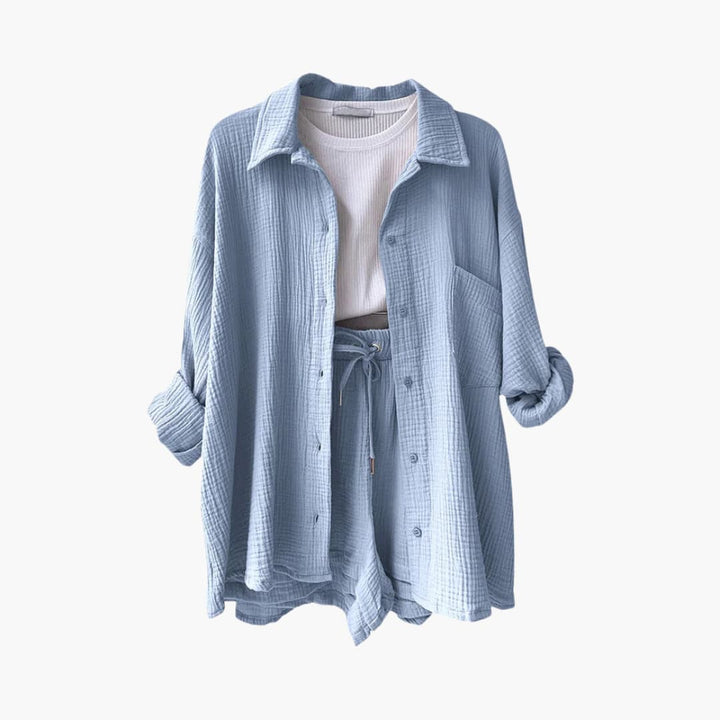 Casual women's summer outfit: a relaxed fit three-piece set with a shirt, crop top, and high-waist shorts.
