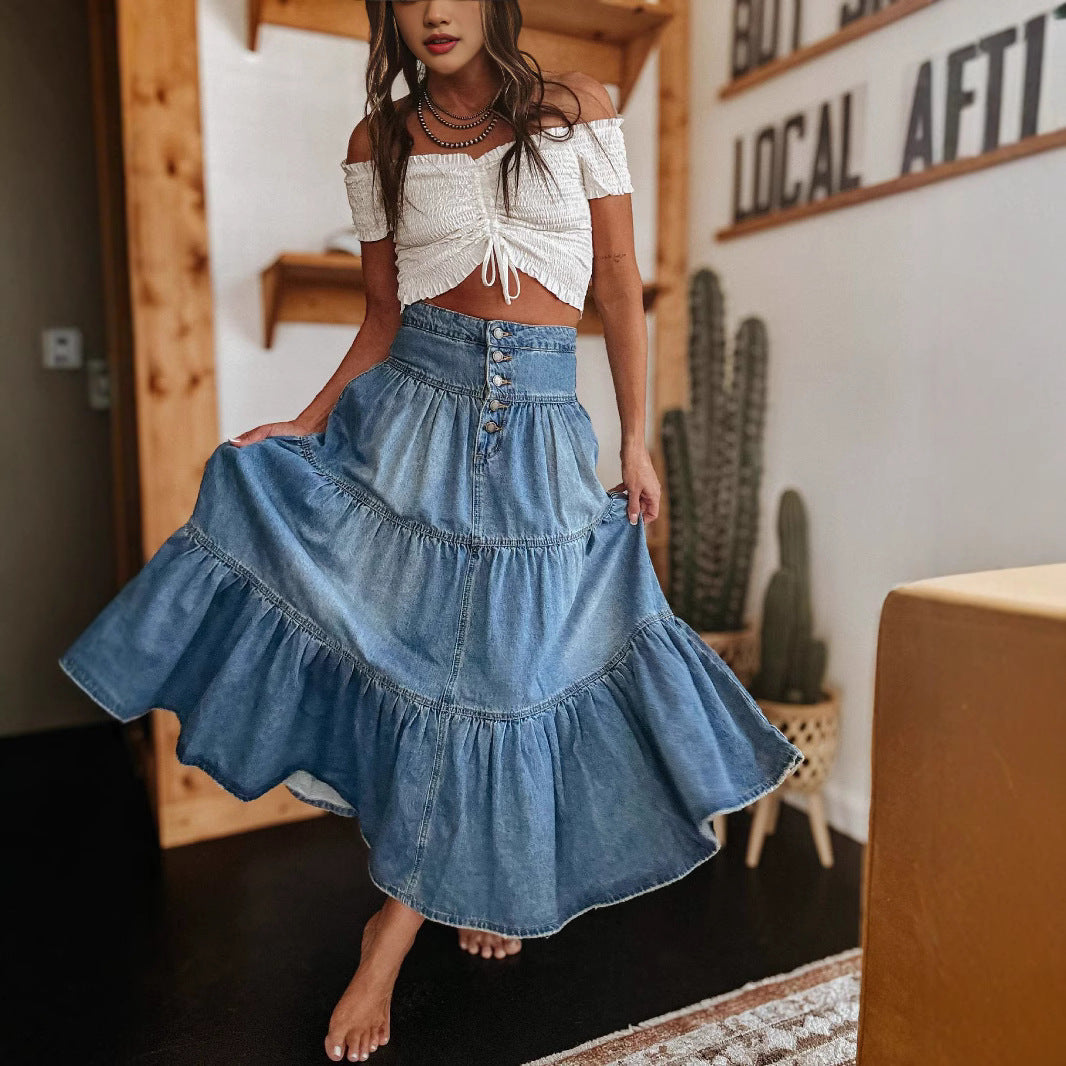Flowy women's maxi skirt featuring multiple tiers, a trendy button-front closure, and unique raw hem detail.
