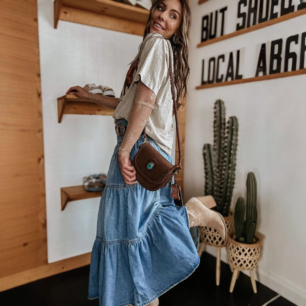 Casual women's tiered maxi skirt in a versatile style, designed with a chic button front and fashionable raw hem.