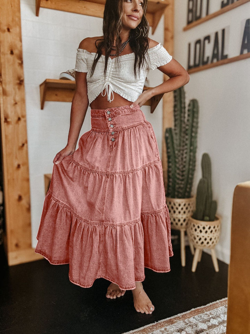 Detail shot of the trendy raw hem on a comfortable and flowy women's tiered maxi skirt. Casual & versatile.