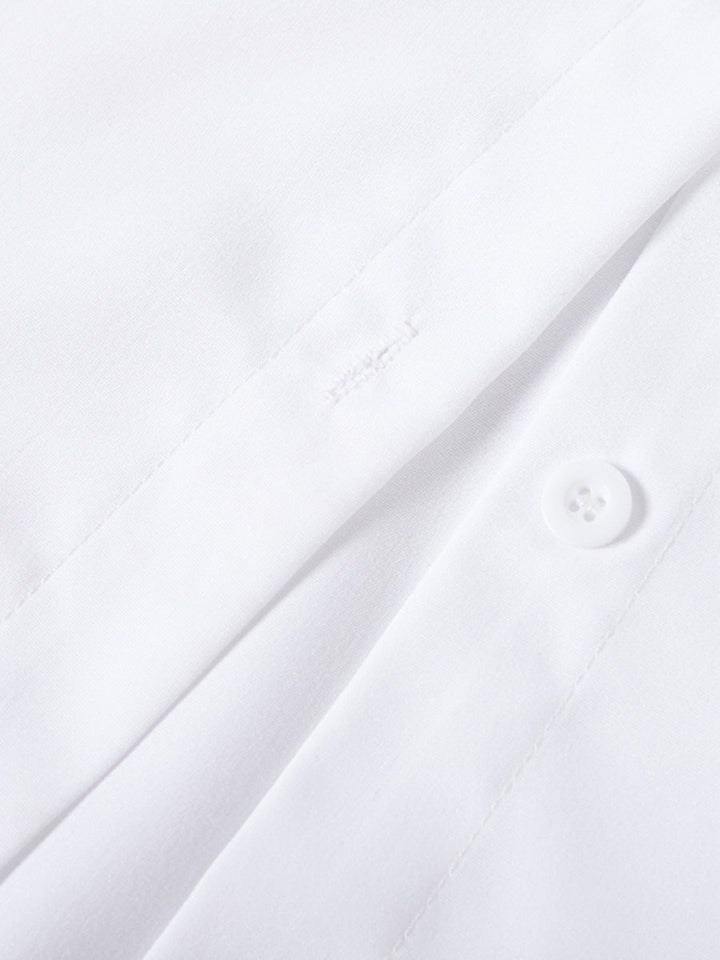 Classic women's button up blouse, updated with tiered ruffles and elegant flare cuffs.