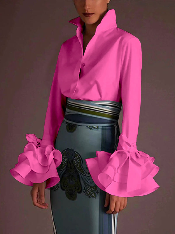 Casual women's tiered blouse with delicate ruffle cuffs and timeless button up style.